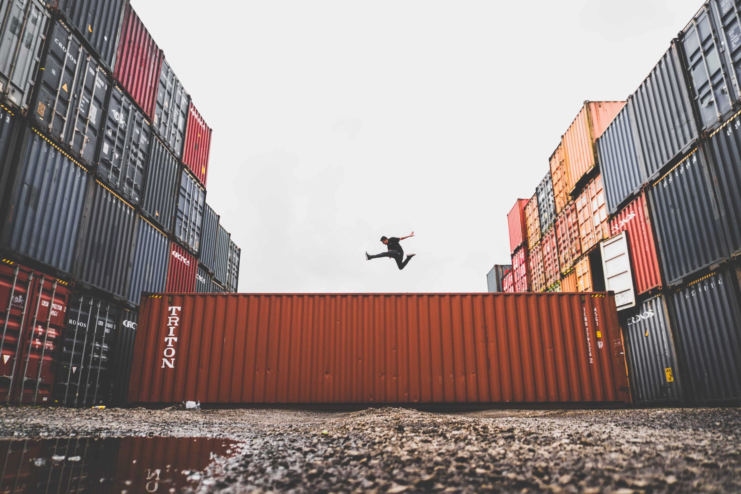 Man jumping on shipping container