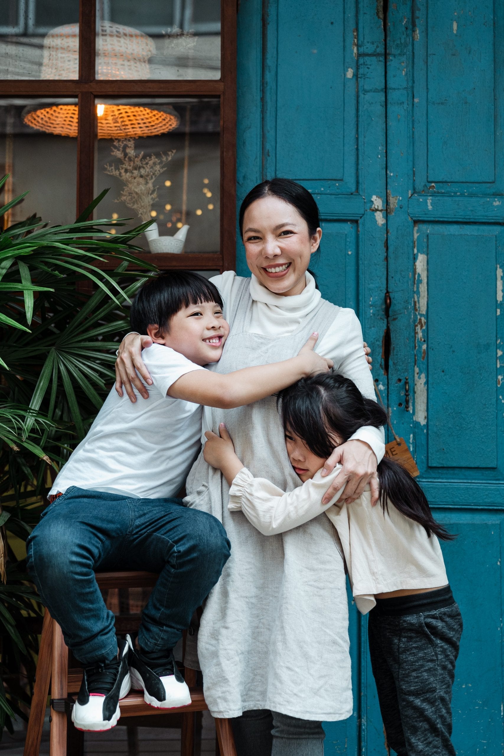 A mother hugging her children on Mother’s Day